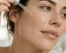 Woman cleansing her face as part of a skincare routine for congested skin and clogged pores